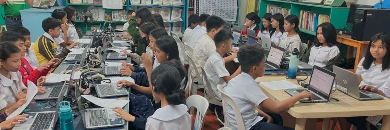 Filipino students working on a computer