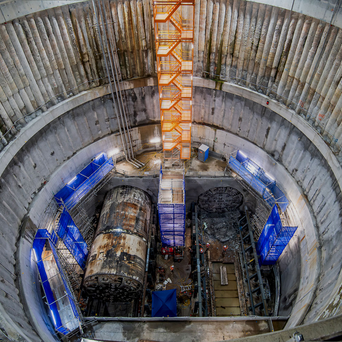Excavation shaft for the Sydney Metro Western Sydney Airport Station, Boxes and Tunnelling works, showing TBM cutterheads and construction platforms.