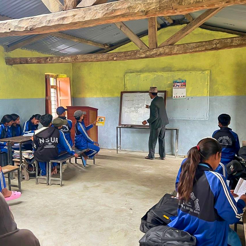Australian Himalayan Foundation Project - male teacher teaching to the class